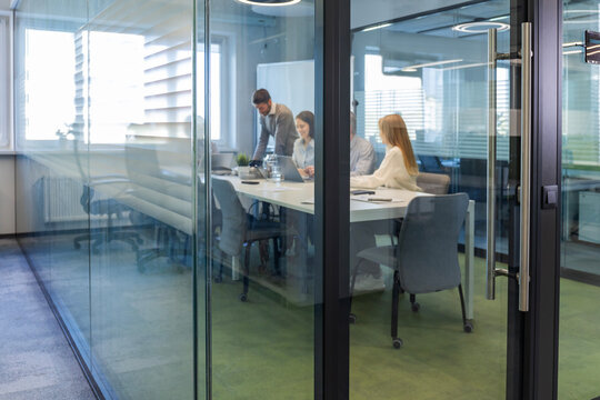 Business office with blurred people casual wear, with blurred bokeh background.