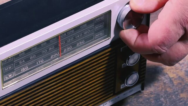 Tuning a portable radio to find different audio waves and frequencies