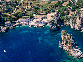 Naklejka premium Beauty of the nature of the Sicilian coasts. Bay of Scopello and its stacks. View from above.