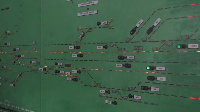A complex railway traffic control panel with various switches and buttons.