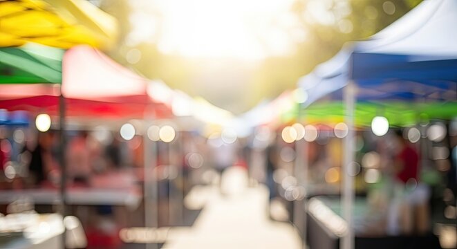Blurred Background of Outdoor Market Stalls with Colorful Tents and Sunlight.
