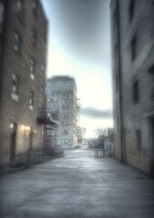 Fototapeta premium Urban Alleyway - A Glimpse of City Life Through Narrow Streets.