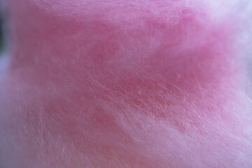 Naklejka premium Macro texture of pink cotton candy sugar threads background close up