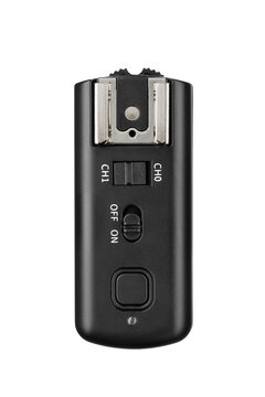 Black flash trigger with hot shoe connector isolated. Transparent PNG image.
