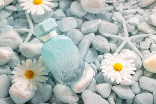 Unique blue perfume as symbol of sea breeze and freshness.