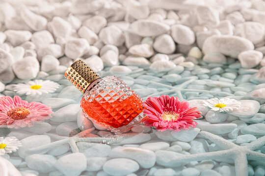 Intense red perfume with breeze enclosed in a bottle.