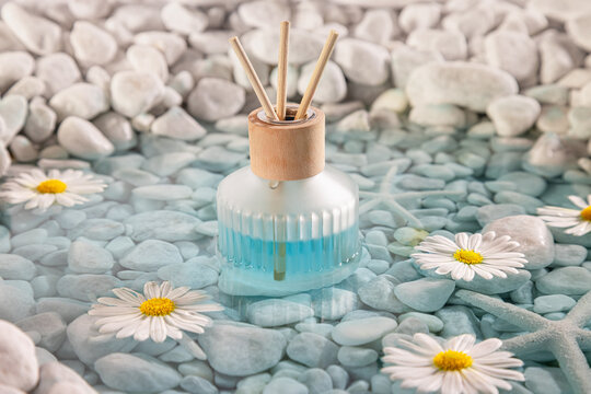 Intense diffuser fragrance on the coast of white stones.