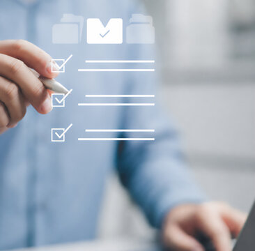 Man checking off tasks on a digital checklist