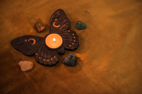 Mystic esoteric concept with Tarot attributes. Candles and crystals