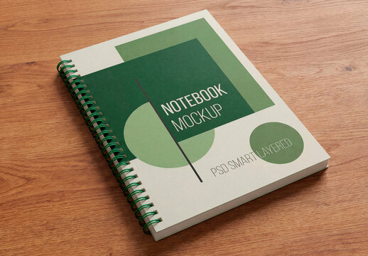 Spiral Notebook Mockup On Wooden Desk