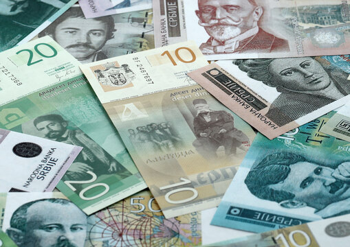 Serbian dinar money banknotes pile on table. Serbia bills of RSD currency. Concept of economy