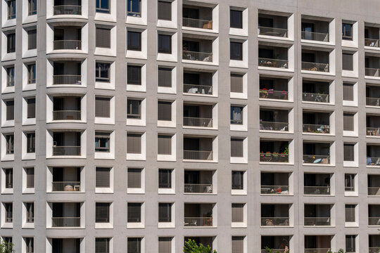Balconies and windows grid a Lyon France apartment building facade, making residential architecture read as precise urban repetition