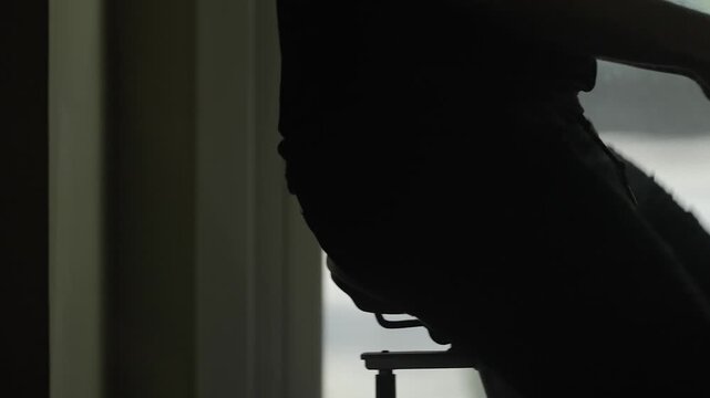 Close-up hands gripping handlebars during intense gym workout session