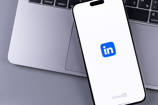 LinkedIn logo mobile icon app on a screen smartphone iPhone. LinkedIn is a social network for finding and establishing business contacts. Batumi, Georgia - March 23, 2026
