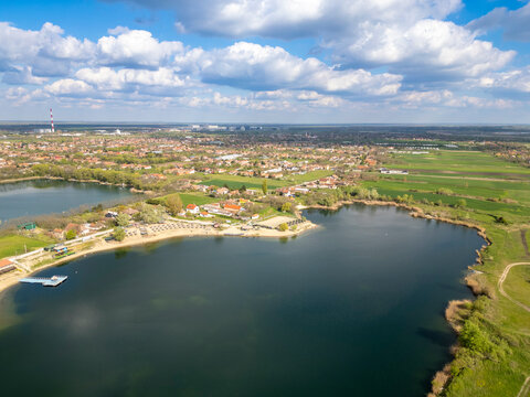 Zrenjanin peskara lake aerial view with beach town and blue sky