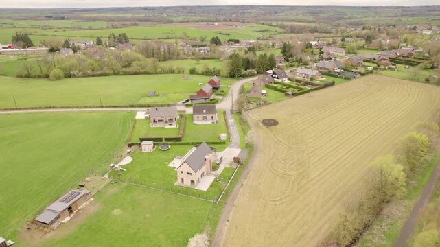 Drone View of Belgian Rural Village and Farmland in Wallonia, Countryside Homes Surrounded by Agricultural Fields