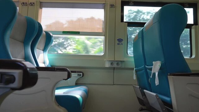 Empty Train Interior with Window View of Passing Scener