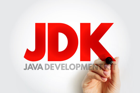 JDK JAVA DEVELOPMENT KIT written by hand with marker. Technology software term JDK representing programming tools for coding, compilation, and execution in developer environment