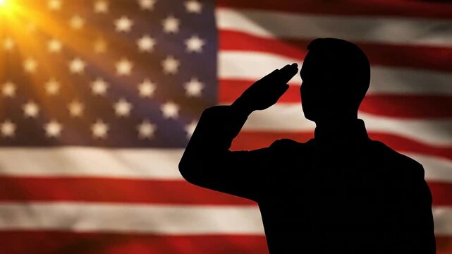 Soldier salutes proudly in front of waving American flag at sunset