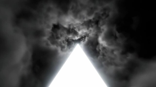 A bright triangular light shines through dark and cloudy skies