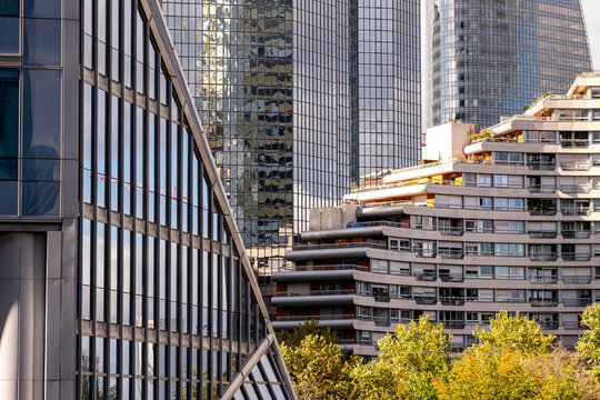Apartments and glass towers layer La Defense Paris France, where skyscraper architecture gives the urban business district a dense edge