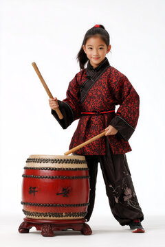 Young Asian girl in traditional costume playing Chinese drum on white background