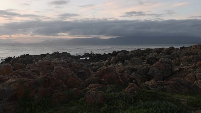 rocky coastline of DeKelders, Gansbaai, South Africa at sunset
