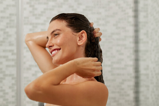 Beautiful woman taking a shower and relaxing