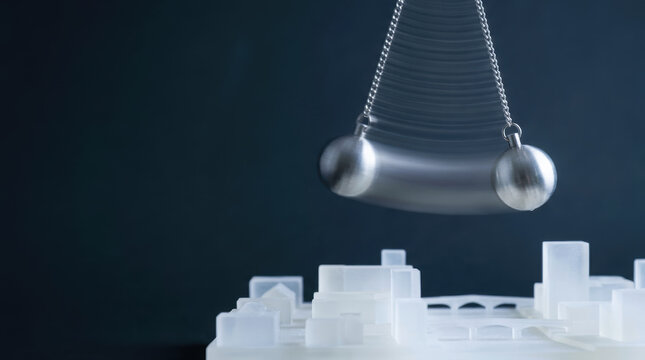 Pendulum motion physics model construction management science balance energy experiment metal chain swing architecture building concept design