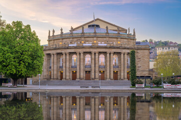 Naklejka premium Stuttgart State Opera House Reflected In Water At Sunset, Germany, European Architecture And Cultural Landmark