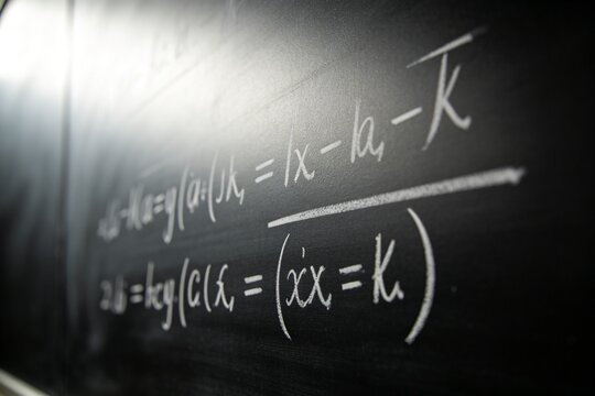 Mathematical equations written on blackboard