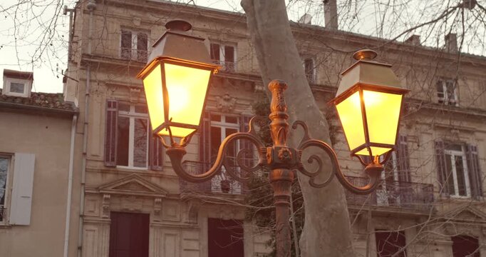 Classic decorative street lamp in Narbonne France captured in bright sunshine with clear blue sky background