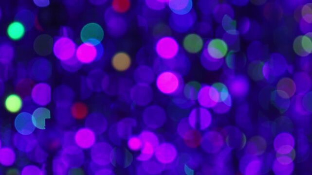 Dreamy blurred light background with glowing colorful spheres creating magical atmosphere