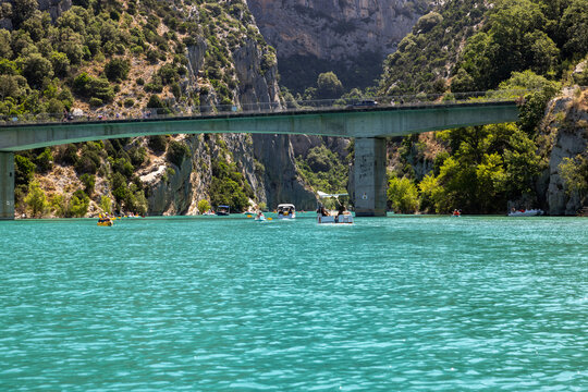 Tourists explore the Verdon Gorge in pedal boats, kayaks and paddle boats. An ideal place for an active holiday in Provence-Alpes-C&ocirc;te d'Azur, France.