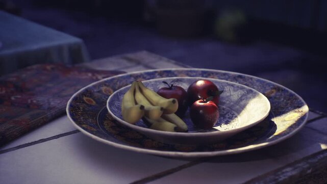 Evening snapshot of plated fruit scene, dim ambient light with overlapping plates and soft grain, empty aisles and distant lanterns hint at ongoing market life