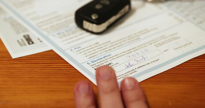 Completing the V62 application for a registration certificate form to request V5C document during selling a car.