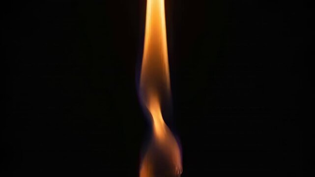 Filming vertical flame narrowing and forming bulb in dark studio, responding to draft at wick