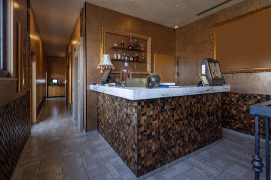 Luxury marble bar counter with wooden mosaic and gold decor