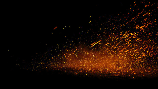 Bright orange fire sparks and glowing embers scattered across a dark black background. Dramatic burning dust and smoldering particles with realistic heat glow.
