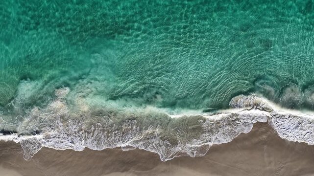 Drone view of crystal clear water and sand, Alkimos Beach, Perth