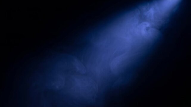 Diagonal Blue Volumetric Light Beam with Drifting Atmospheric Mist