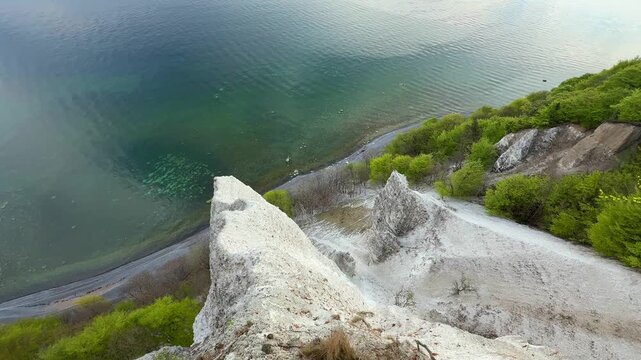 View of famous white chalk cliffs in Jasmund National Park on Rugen island, Germany. Scenic Baltic Sea coastline from forest trail