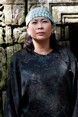 Fototapeta premium Portrait of woman wearing the traditional Khmer Krama on her head. Siem Reap. Cambodia.