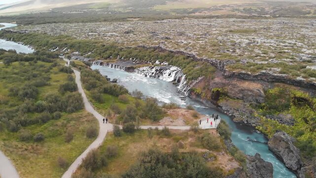 Iceland Waterfalls aerial view. Hraunfossar on a cloudy summer day. Slow motion