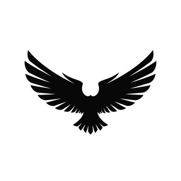 Black silhouette of an eagle with wings spread wide in flight