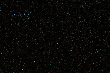 Fototapeta premium Dense starfield in deep outer space with glowing celestial lights