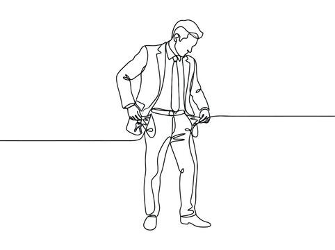 A man in a suit turns his empty pockets inside out while looking down in despair