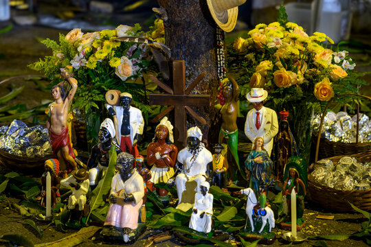 Altar dedicated to various Umbanda entities on a day of celebration.