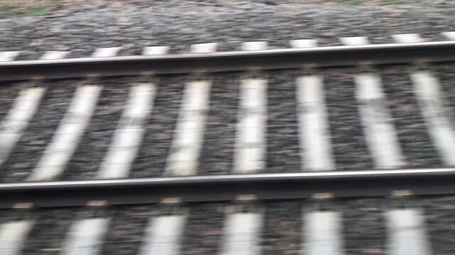 railroad, rails, sleepers outside the window of a moving train