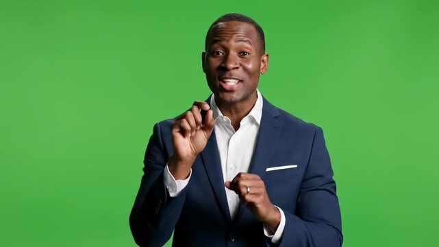 African american businessman presenting on green screen background, presenter speaker